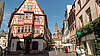 bild Historic half-timbered house in an old town alley with colourful facades.